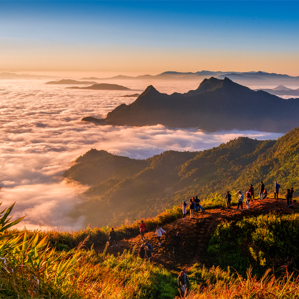 Group of people looking out over a mountain side