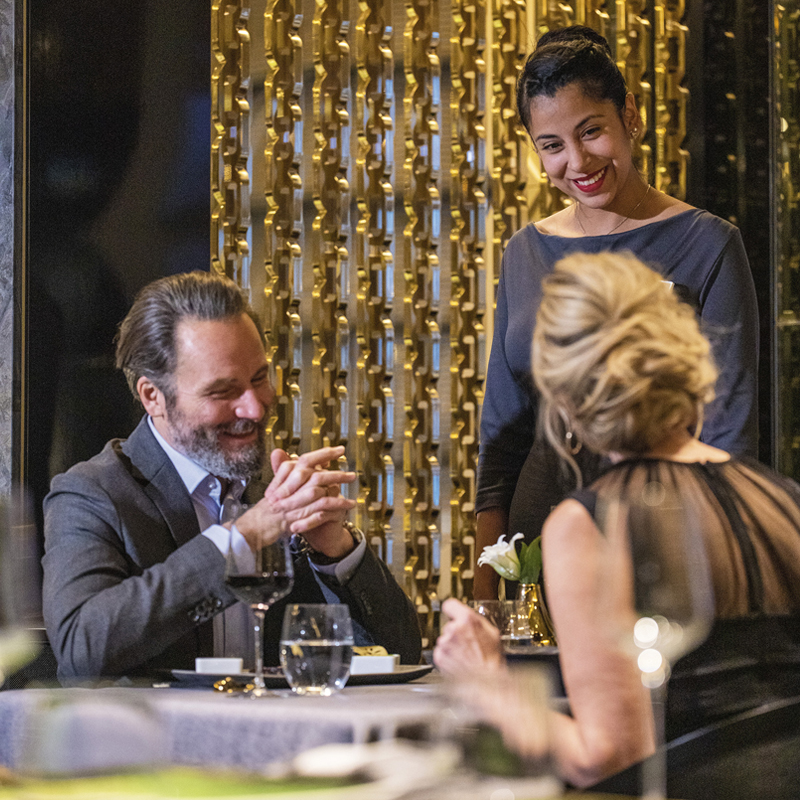 Waitress serving guests