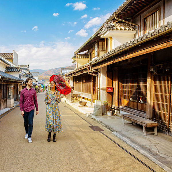 Tokushima Udatsu. Couple walking on a dirt road