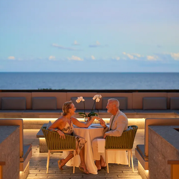 Guests enjoying an intimate al-fresco dinner featuring a curated four-course menu from Malpeque